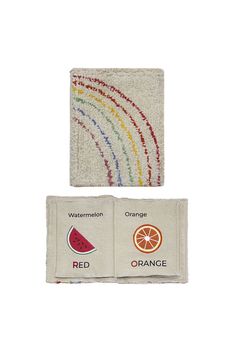 two towels with oranges, watermelon and red designs on them are shown