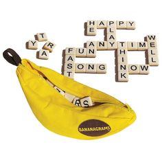 a banana and some scrabbles on a white background