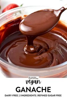 a spoon full of vegan ganache in a glass bowl