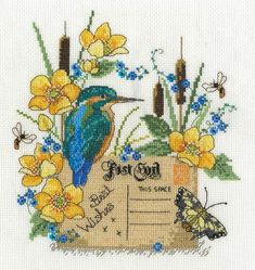 a blue bird sitting on top of a piece of paper with yellow flowers and butterflies around it