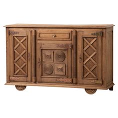 the sideboard is made out of wood and has intricate carvings on the doors, which are