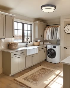 a laundry room with a washer and dryer in it