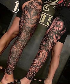 two people with tattoos on their legs