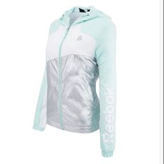 Price Is Firm. Offers Not Accepted. Nwt Reebok Women’s Windbreaker Jacket In Mint Green, White And Metallic Silver. Size Small. Features: Adjustable Hood W/Draw Cord Light Weight & Weather Resistant Fleece Lining 2 Front Pockets Full Zip Closure Check Out My Closetbundle Multiple Items To Save On Shipping! One Shipping Price No Matter The Number Of Items! *Cross Posted - Smoke Free Home* Sporty Winter Windbreaker For Workout, Sporty Winter Workout Windbreaker, Winter Workout Sporty Windbreaker, White Sporty Fleece Jacket For Sports, Sporty Fleece Windbreaker For Sports, Sporty Spring Outdoor Fleece Jacket, Spring Sports Fleece Outerwear, White Gym Outerwear With Drawstring Hood, Cord Light