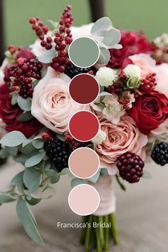 a bridal bouquet with roses, berries and greenery in shades of red, pink, green