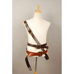 a white mannequin with brown leather straps