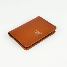 Our minimal leather card holders are handmade in our London workshop by our small team. They are designed to get better with age and wear. This slim wallet is made from our beautiful Italian coloured leather, the design is elegant, timeless and a practical accessories for everyday use. - Made from Italian Leather - Three separate card pockets - Dimensions: 75mm x 100mm If you're buying as a gift for a loved one why not make it that bit extra special with our monogramming service... Simply choose the option above and let us know in the Notes section what you'd like. Have fun with it! If you'd like to read all about our personalisation service, please take a look at our blog post here .. https://www.villageleathers.com/blogs/behind-the-seams/our-personalisation-service This style is availabl Minimalist Trifold Card Holder With Card Slots, Minimalist Trifold Card Holder For Everyday, Minimalist Leather Trifold Wallet With Card Slots, Minimalist Leather Trifold Wallet With Interior Card Slots, Modern Brown Card Holder For Gift, Modern Brown Card Holder As Gift, Modern Brown Card Holder Gift, Minimalist Leather Card Holder With Rfid Blocking, Minimalist Leather Bifold Card Holder