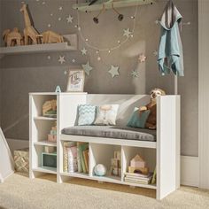 a child's room with toys and bookshelves