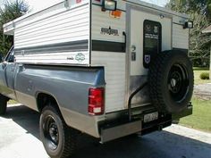 a truck with a camper attached to the back