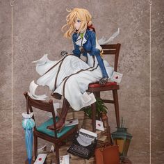 a doll sitting on top of a pile of books