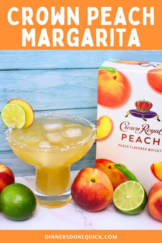 a drink in a glass next to some fruit and a carton of crown peach margarita