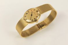 "Ladies 18K Yellow Gold Universial Geneve Bracelet Watch, Model \" Classic\", with 17 Jewel Manual Wind movement, runs well, Cal 42, Serial # 32618, 7 inch long Total Weight: 41.1 grams Vintage Estate Gold, all items have been tested and examined. These are all one of a kind items. Shipping: All items are hand-picked and packed. I usually ship 5-10 days from your purchase, but this may vary depending on the season." Elegant Formal Watch Accessories: Jubilee Bracelet, Elegant Jubilee Bracelet Watch Accessories For Anniversary, Elegant Yellow Gold Watch Accessories With Jubilee Bracelet, Elegant Yellow Gold Jubilee Watch Bracelet, Elegant Gold Jewelry And Watches For Formal Occasions, Elegant Yellow Gold Jewelry For Formal Occasion, Elegant Yellow Gold Jewelry And Watches For Formal Occasions, Elegant Formal Hallmarked Jewelry And Watches, Elegant Gold Watch Accessories For Evening