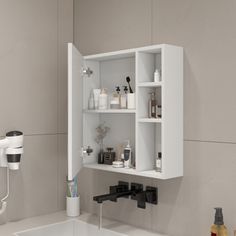 a white sink sitting under a bathroom mirror next to a faucet and soap dispenser