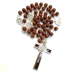 Wooden Saint Benedict Rosary - blessed by Pope FrancisA magnificent, beautiful and powerful rosary.Made of honey-brown wooden beads and silvered links, cross and rosary center. Ideal for a classy person! Look at the big rounded beads."The intercession of St. Benedict is known to have power and our faith can release this power. The medal is reminder that we are protected by the power of Christ."It has been blessed by Pope Francis during public audience in Saint Peter Square & on request it ca Jesus Passion, Wooden Rosary, Saint Peter Square, Rosary Beads Catholic, Saint Peter, Rosary Prayer, St Benedict, Saint Benedict, Hail Mary