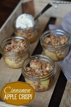 three jars filled with food sitting on top of a wooden tray