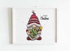 a cross stitch christmas ornament in a white frame