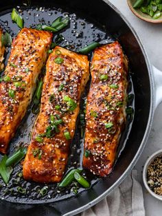 salmon with sesame seeds and green beans in a skillet