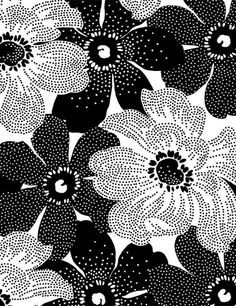 a black and white flower pattern with dots in the center, on a white background