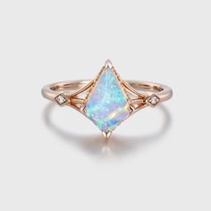 Kite Cut Opal and Diamond Bridal Ring in the warm embrace of rose gold—a mesmerizing fusion of opulence, elegance, and natural beauty. 14k Rose Gold Jewelry With Halo Design, 14k Rose Gold Gemstone Wedding Jewelry, Luxury Rose Gold Opal Gemstone Ring, Formal Rose Gold Opal Ring With Diamond, Rose Gold Diamond Opal Ring Fine Jewelry, Rose Gold Opal Diamond Ring, Rose Gold Opal Diamond Ring Fine Jewelry, Elegant Opal Ring With Diamond In Rose Gold, Rose Gold Opal Diamond Ring In Fine Jewelry Style