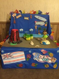 a blue suitcase with hawaiian decorations on it