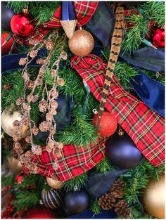 a christmas tree decorated with ornaments and ribbons