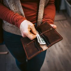 A Leather Long Wallet for those who carry a lot.This wallet was designed to carry unfolded bills, a lot of cards, and even your checkbook. For those of us who like the minimalist approach, but refuse to downsize the cards we carry. Featuring an optional lever snap chain so you can always have the Long Wallet by your side.Our full-grain leather means your wallet will develop character and patina. We hand-sew this wallet with thick Tiger Thread so it will never unravel or come apart. The wallet fe Bifold Wallets With Card Slots For Organization, Bifold Wallets With Interior Card Slots, Bifold Wallet With Card Slots, Trucker Wallet, Brown Tiger, Biker Wallet, Horween Leather, Engraved Initials, The Minimalist