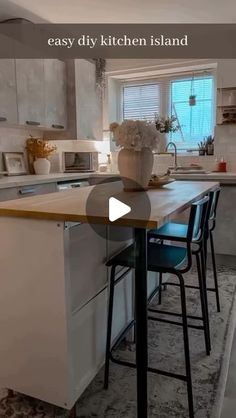 a kitchen island with stools in front of it and the words easy diy kitchen island