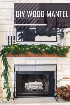 a fireplace mantle decorated with greenery and candles for the holiday mantel decorating