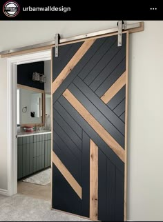 an open door with wood planks in the middle and black paint on the side