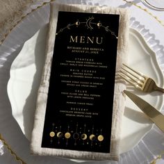 a black menu on a white plate with gold trimmings and a fork next to it