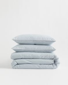 four pillows stacked on top of each other