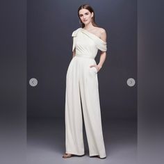 Excellent Condition! Never Worn. No Flaws. Just Needs A Good Steam. Perfect For Rehearsal Dinner, Bachelorette Or Wedding Reception Or After Party. Get It Before It’s Gone! White Off-shoulder Evening Jumpsuits And Rompers, White Off-shoulder Jumpsuits And Rompers For Evening, Elegant Summer Wedding Pantsuit, Chic White Jumpsuit For Wedding Guests, Chic White Jumpsuits And Rompers For Wedding Guest, White One-shoulder Jumpsuit For Evening, Chic White Jumpsuit For Event, Elegant Cream Jumpsuits And Rompers For Party, Elegant Cream Jumpsuit For Party