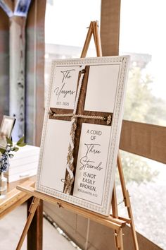 a wooden easel with a cross on it