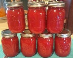 there are many jars with red liquid in them