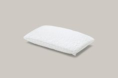 a white pillow on a gray background