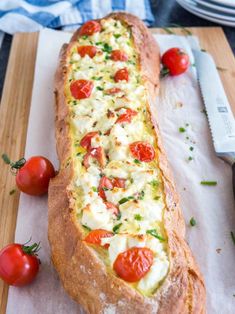 the bread has tomatoes and cheese on it