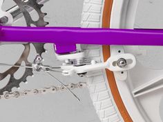 the front wheel of a bicycle with purple spokes and white rims on it