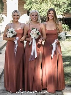 three bridesmaids in brown dresses posing for the camera