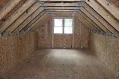 an attic with straw bales on the floor