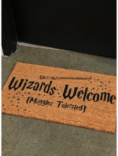 a welcome mat that says wizard's welcome hangs tailored in front of the door