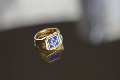 "very unique gold masonic signet ring with blue enamel and a revolving face ♡ very delicately handcrafted. the revolving face design would allow us to make additional inside engravings or a special note if you are considering this ring as a gift to a special someone. extra side or inside engravings cost 12 USD  please contact us if you request side/inside engravins or please go back to our shop and purchase the \"Side or inside engraving fee\" listing. material options:  9k gold 14k gold 14k rose gold 14k white gold 18k Gold 18k Rose Gold 18k White Gold shipping: ♡ all our listings include free expedited shipping delivers in 2-4 business days enamel : please consider that the color shade of the enamel may be different than pictures little bit because of the perspective and lightening of th Mason Ring, Freemason Ring, Free Mason, Masonic Ring, Ring Mens, Face Design, Ring Unique, Jewelry Cleaner, Signet Ring