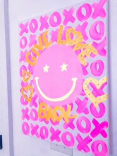 a pink and yellow painting with the words xoxo on it's face