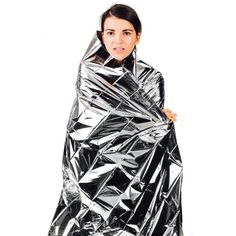 a woman wrapped in aluminum foil posing for the camera with her hands on her hips