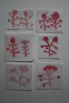 four squares with flowers drawn on them