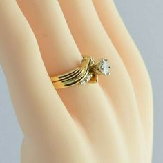 "Vintage 14K Yellow Gold Diamond Ring and Guard, 40pt center, HSI - 4 round sides, bypass design, shiney, 3/8\" across, Ring size 6.25, Circa 1960, 5.2 grams Stock # BB220R57 Most rings are sizable for a small fee. If the ring you are considering is the incorrect size contact us for a quote. This listing contains photographs of the actual item you will receive. Our items are in excellent condition with little or no signs of wear and many are one of a kind pre-owned estate finds. Please look clos Gold Bypass Ring With Diamond Cut For Anniversary, Gold Diamond Cut Bypass Ring For Anniversary, Classic Gold Bypass Ring With Diamond Cut, Gold Solitaire Bypass Ring For Anniversary, Gold Bypass Ring For Anniversary, Gold Bypass Ring With Round Cut For Anniversary, Gold Round Cut Bypass Ring For Anniversary, Classic Gold Bypass Ring, Gold Round Bypass Ring For Formal Occasions