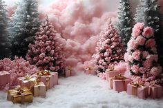 pink and gold christmas trees with presents in the snow