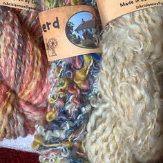 two skeins of yarn sitting next to each other