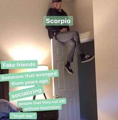 a man sitting on top of a door with the words scorpio above him