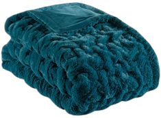 a teal colored blanket folded on top of each other