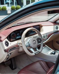 the interior of a car with dashboard, steering wheel and dash board on display at an automobile dealership